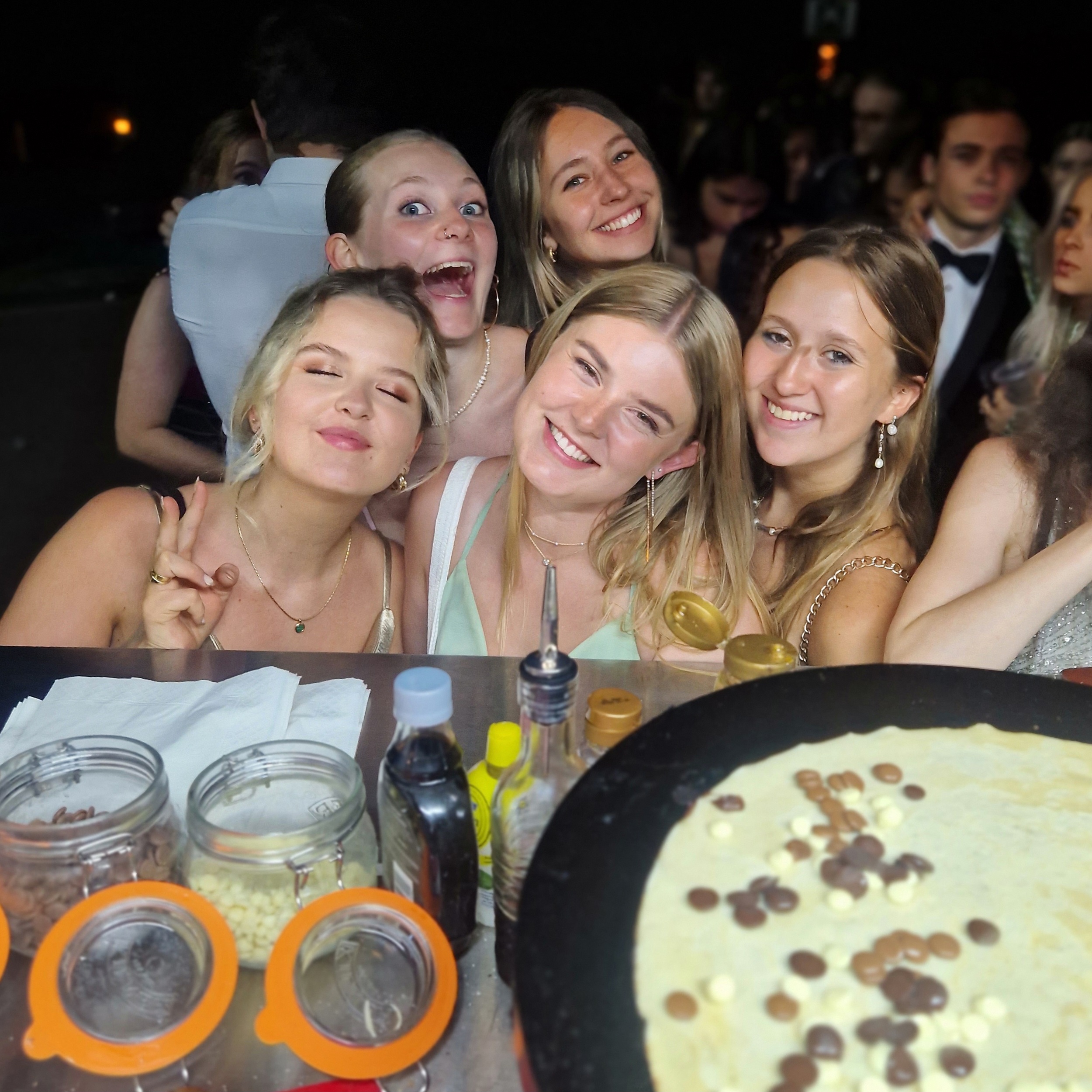 Guests enjoying crepes at a college ball